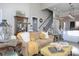 Cozy living room featuring a beige sofa, yellow throw, and decorative pillows at 600 E Monbo Rd, Statesville, NC 28677