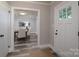 Inviting entryway with view of dining room and hardwood flooring at 6211 Rock Island Rd, Charlotte, NC 28278