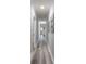 Light and bright hallway with wood-look floors at 6211 Rock Island Rd, Charlotte, NC 28278