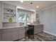 Built-in desk and shelving in this home office with plenty of natural light at 6211 Rock Island Rd, Charlotte, NC 28278