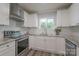 Modern kitchen featuring stainless steel appliances and granite countertops at 6211 Rock Island Rd, Charlotte, NC 28278