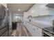 Bright kitchen with white cabinets, granite counters, and stainless steel appliances at 6211 Rock Island Rd, Charlotte, NC 28278