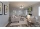 Light-filled living room with a fireplace and comfortable seating arrangement at 6211 Rock Island Rd, Charlotte, NC 28278