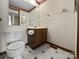 Clean bathroom with toilet, sink, and vanity at 6619 Wagon Oak Rd, Charlotte, NC 28212