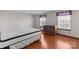 Bedroom with wood flooring and a dresser at 6619 Wagon Oak Rd, Charlotte, NC 28212