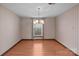 Simple dining room with hardwood floors and striped wallpaper at 6619 Wagon Oak Rd, Charlotte, NC 28212