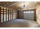 Garage with built-in shelving and ample space at 6619 Wagon Oak Rd, Charlotte, NC 28212