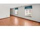 Spacious living room featuring hardwood floors and ample natural light at 6619 Wagon Oak Rd, Charlotte, NC 28212