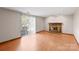 Living room with fireplace and sliding glass doors at 6619 Wagon Oak Rd, Charlotte, NC 28212