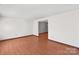 Bright living room with hardwood floors and neutral walls at 6619 Wagon Oak Rd, Charlotte, NC 28212