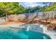 Swimming pool with a stone waterfall feature at 7647 Black Hawk Ln, Tega Cay, SC 29708