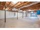 Unfinished basement with high ceilings and garage access at 7704 Woodland Hills Rd, Hickory, NC 28602