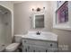 Updated bathroom features a vanity, toilet and shower at 7704 Woodland Hills Rd, Hickory, NC 28602