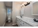 Bathroom with double vanity and marble countertop at 7704 Woodland Hills Rd, Hickory, NC 28602