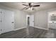 Bedroom with grey wood-look floors and two closets at 7704 Woodland Hills Rd, Hickory, NC 28602