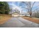 Ranch home with gray siding and an attached garage, long driveway at 7704 Woodland Hills Rd, Hickory, NC 28602