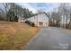 House exterior with a driveway and landscaping at 7704 Woodland Hills Rd, Hickory, NC 28602