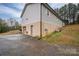 View of the home's exterior and garage at 7704 Woodland Hills Rd, Hickory, NC 28602