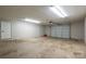 Spacious garage with overhead door and extra space at 7704 Woodland Hills Rd, Hickory, NC 28602