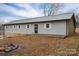 Rear view of a ranch home with gray siding and a patio at 7704 Woodland Hills Rd, Hickory, NC 28602