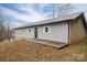 Rear view of a ranch home with gray siding and patio at 7704 Woodland Hills Rd, Hickory, NC 28602