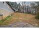 Side view of a gray house with wooded area behind at 7704 Woodland Hills Rd, Hickory, NC 28602