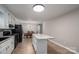 Spacious kitchen with granite countertops and black appliances at 7704 Woodland Hills Rd, Hickory, NC 28602