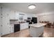 Kitchen with white cabinets, granite countertops, and black appliances at 7704 Woodland Hills Rd, Hickory, NC 28602