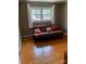 Bright bedroom with hardwood floors and a futon at 904 Mascot Dr, Albemarle, NC 28001