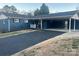 Ranch home with blue exterior, carport, and landscaped yard at 904 Mascot Dr, Albemarle, NC 28001