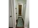 Clean hallway with light walls and a linen closet at 904 Mascot Dr, Albemarle, NC 28001