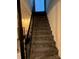 Carpeted staircase leading to the upper level at 904 Mascot Dr, Albemarle, NC 28001