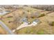 Aerial view of home with a detached garage and a pond nearby at 9175 Cox Rd, Mount Pleasant, NC 28124