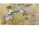 Aerial view of a home, detached garage, and driveway at 9175 Cox Rd, Mount Pleasant, NC 28124