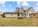 A home with a hot tub and deck, surrounded by a grassy yard at 9175 Cox Rd, Mount Pleasant, NC 28124