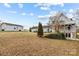 Large backyard with shed and home with deck at 9175 Cox Rd, Mount Pleasant, NC 28124