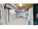 Unfinished basement with washer, dryer and water softener at 9175 Cox Rd, Mount Pleasant, NC 28124