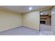 Spacious basement room with view of a brick fireplace at 9175 Cox Rd, Mount Pleasant, NC 28124