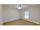 Bright bedroom with neutral walls and carpet at 9175 Cox Rd, Mount Pleasant, NC 28124