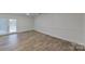 Bright bonus room with wood-look flooring and access to a patio at 9175 Cox Rd, Mount Pleasant, NC 28124