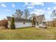 Home's side view showcasing hot tub and deck at 9175 Cox Rd, Mount Pleasant, NC 28124