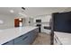 Modern kitchen with white cabinets and a large island at 9175 Cox Rd, Mount Pleasant, NC 28124