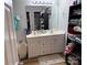 Bathroom featuring a shower, a large mirror over a double sink vanity and a tower of towels at 9624 Langston Mill Rd, Charlotte, NC 28216