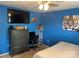This bedroom has a large dresser, a TV on the wall, and a bed at 9624 Langston Mill Rd, Charlotte, NC 28216