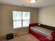 A smaller bedroom features a red twin bed near a window at 9624 Langston Mill Rd, Charlotte, NC 28216