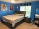 Bright bedroom with a neutral color scheme, a large window, and a ceiling fan at 9624 Langston Mill Rd, Charlotte, NC 28216