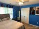 This bedroom has a large window, and a spacious closet space at 9624 Langston Mill Rd, Charlotte, NC 28216
