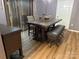 Bright dining room with a rustic table and bench seating at 9624 Langston Mill Rd, Charlotte, NC 28216