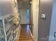 Inviting entryway with wood-look floors and stone accent wall at 9624 Langston Mill Rd, Charlotte, NC 28216