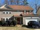 Two-story house with brown siding, red shutters, and a two-car garage at 9624 Langston Mill Rd, Charlotte, NC 28216